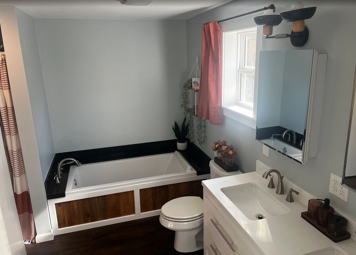 Completed bathroom remodel with soaking tub, granite deck and new vanity