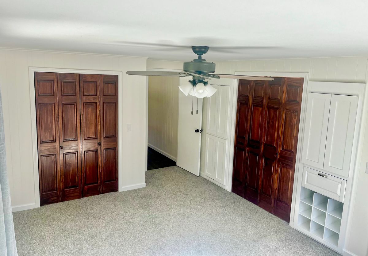Interior finish work with stained wood doors, trim and built-in shelving